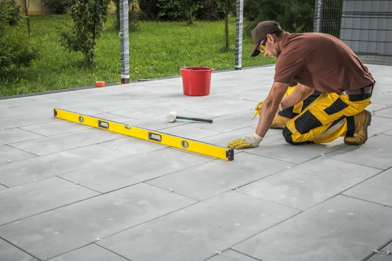 worker installing concrete slabs