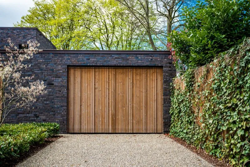 A newly completed concrete driveway showcasing smooth craftsmanship and attention to detail on a Gold Coast property.