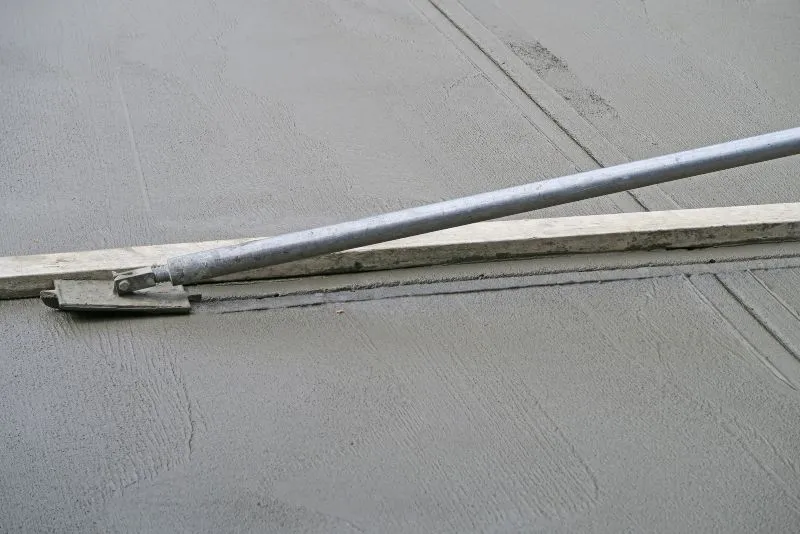 Concrete works in progress, showing the pouring and finishing techniques used to avoid common placement issues.